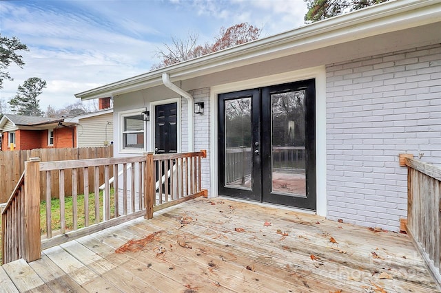 property entrance featuring french doors and a deck