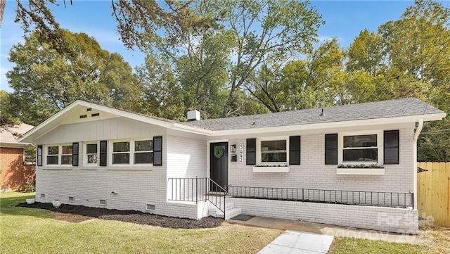 ranch-style home with a front yard