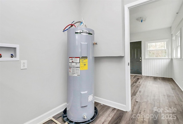 utility room with electric water heater