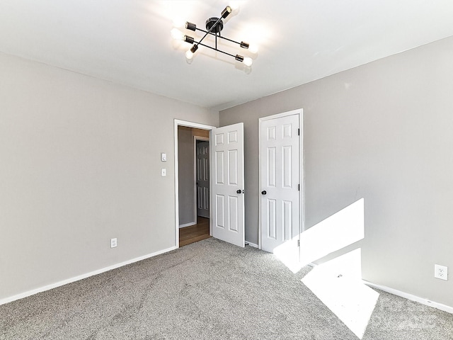 unfurnished room featuring carpet flooring