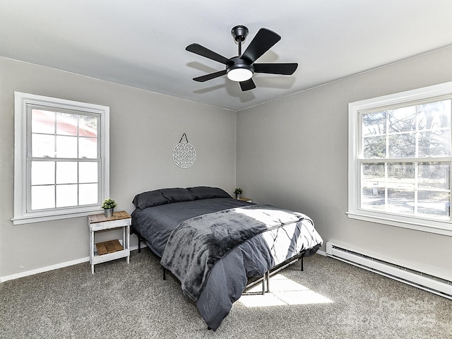 bedroom with a baseboard radiator, carpet, and ceiling fan