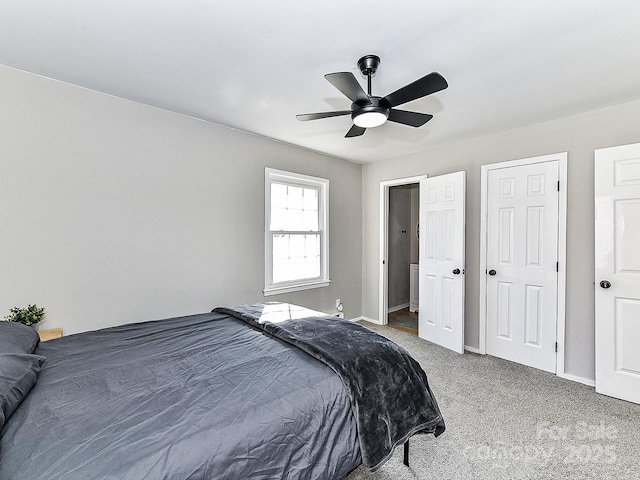 carpeted bedroom featuring ceiling fan