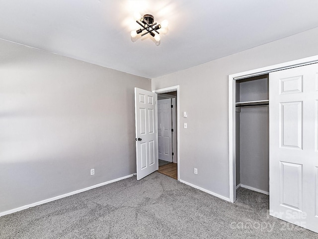 unfurnished bedroom featuring carpet floors and a closet