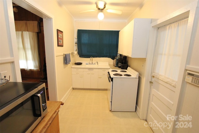 kitchen with ornamental molding, ceiling fan, sink, white cabinetry, and white range with electric cooktop