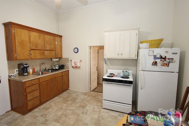 kitchen with white appliances, sink, ceiling fan, ornamental molding, and tasteful backsplash