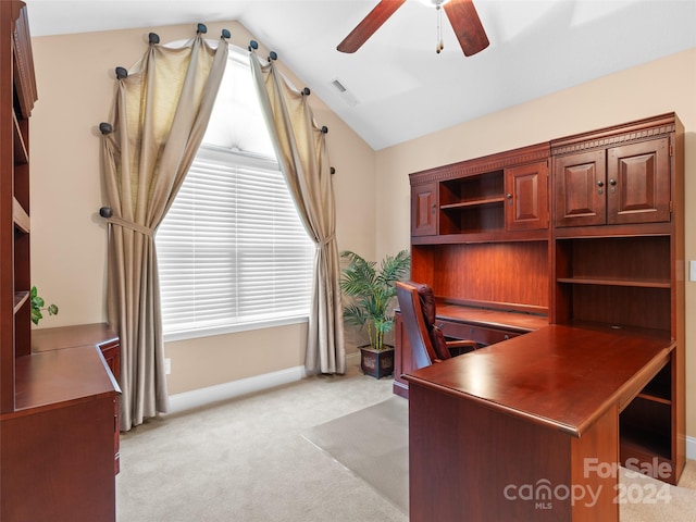 carpeted office space with ceiling fan and vaulted ceiling