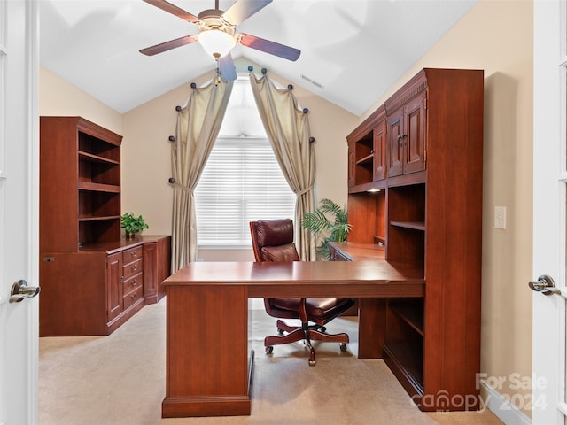 carpeted home office featuring ceiling fan and vaulted ceiling