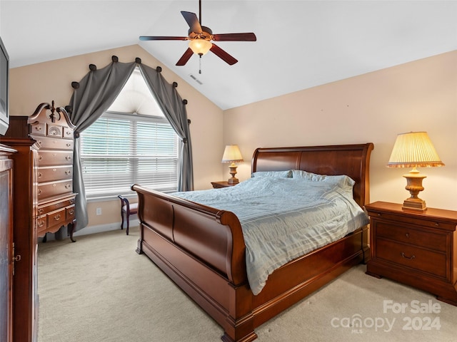 bedroom featuring ceiling fan, light carpet, and lofted ceiling