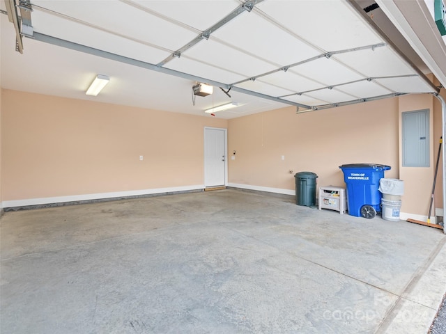 garage featuring electric panel and a garage door opener