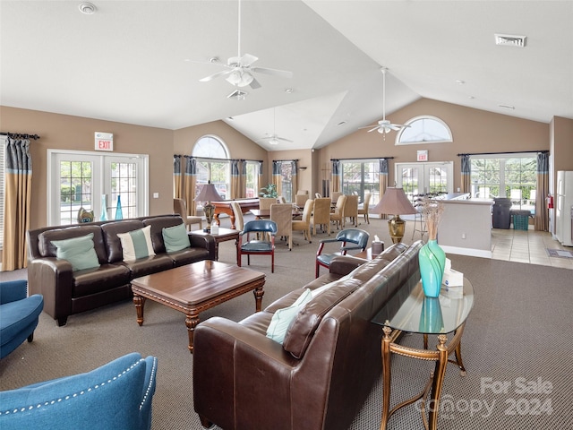 living room with plenty of natural light, ceiling fan, and french doors