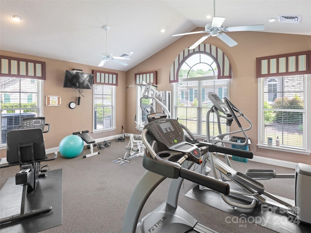 gym with ceiling fan and vaulted ceiling