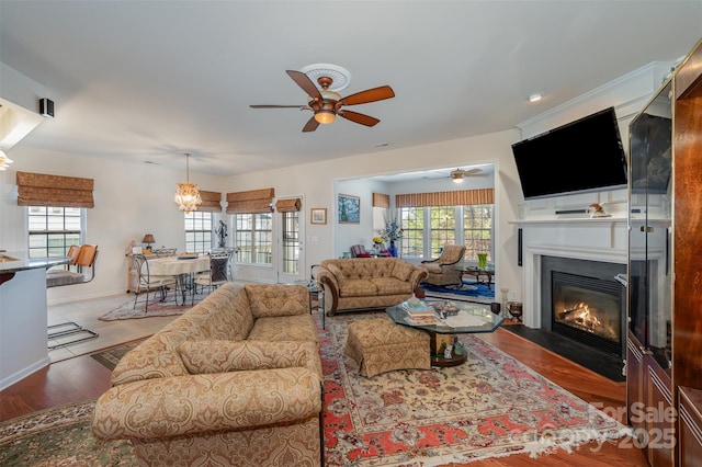 living room featuring wood-type flooring and ceiling fan