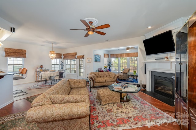 living room with ceiling fan and hardwood / wood-style floors