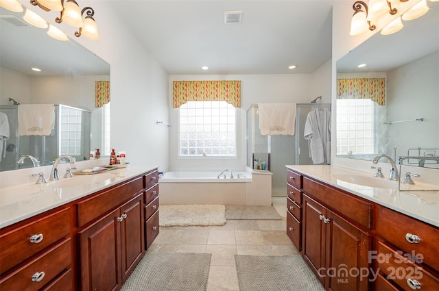 bathroom featuring vanity, tile patterned floors, and separate shower and tub