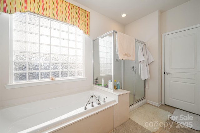 bathroom featuring plus walk in shower