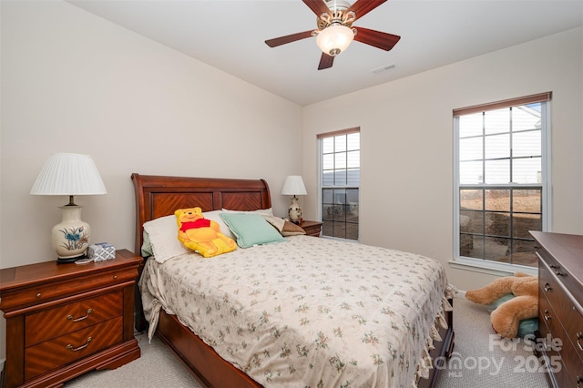 carpeted bedroom with ceiling fan