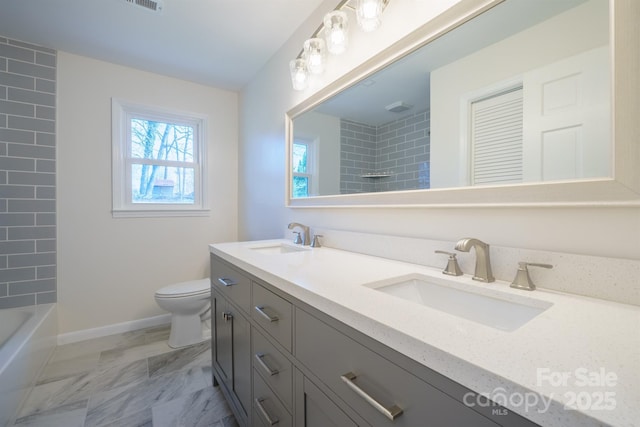 full bathroom with washtub / shower combination, vanity, and toilet