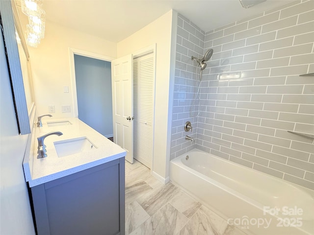 bathroom featuring vanity and tiled shower / bath combo