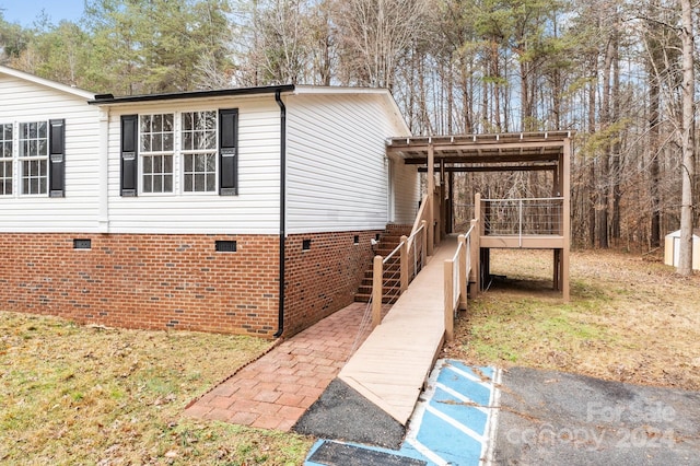 view of home's exterior featuring a deck