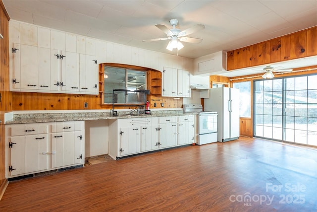 kitchen featuring white appliances, ceiling fan, white cabinets, and wood finished floors