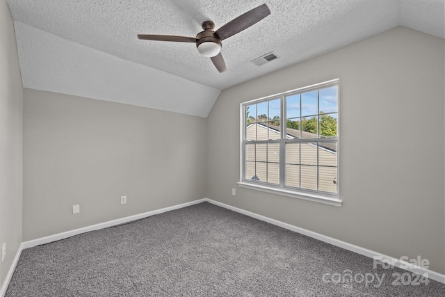 additional living space with ceiling fan, carpet, and lofted ceiling