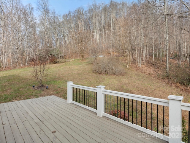 wooden terrace with a yard