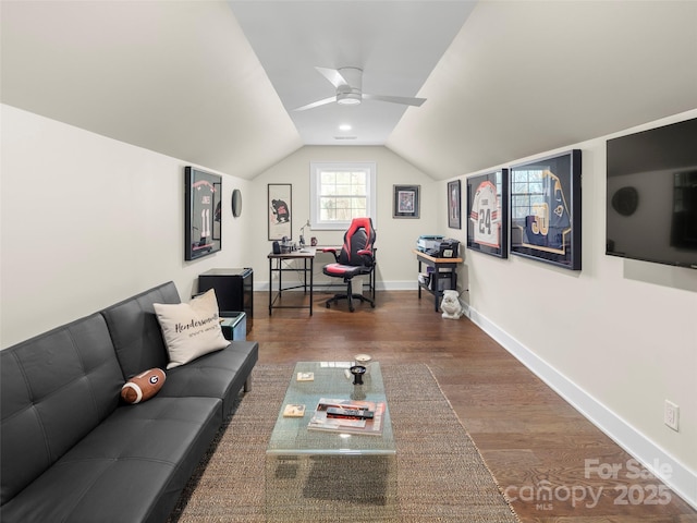 living room with vaulted ceiling, ceiling fan, wood finished floors, and baseboards