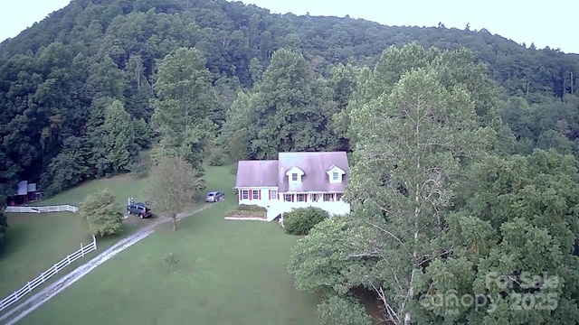 bird's eye view featuring a forest view