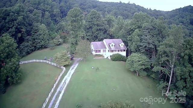 bird's eye view featuring a forest view