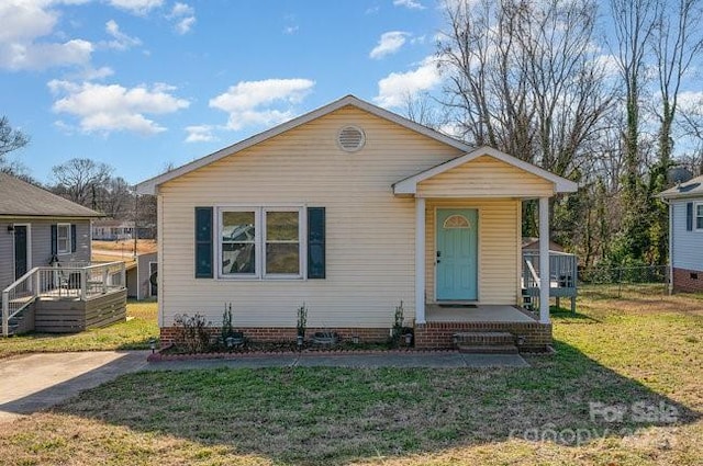 bungalow-style house featuring a front yard