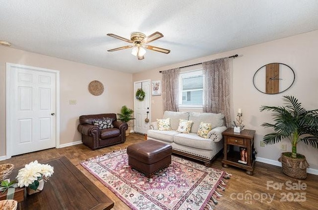 living room with hardwood / wood-style floors and ceiling fan