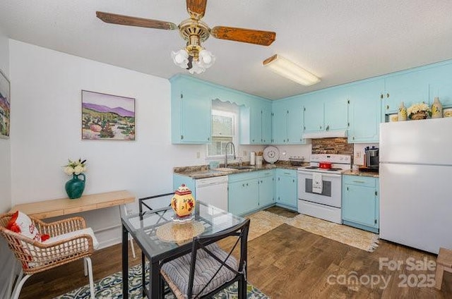 kitchen featuring sink, white appliances, wood-type flooring, and blue cabinetry