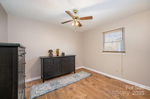 bedroom with hardwood / wood-style flooring and ceiling fan