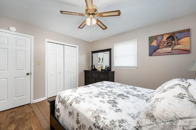 bedroom featuring dark wood-type flooring and ceiling fan