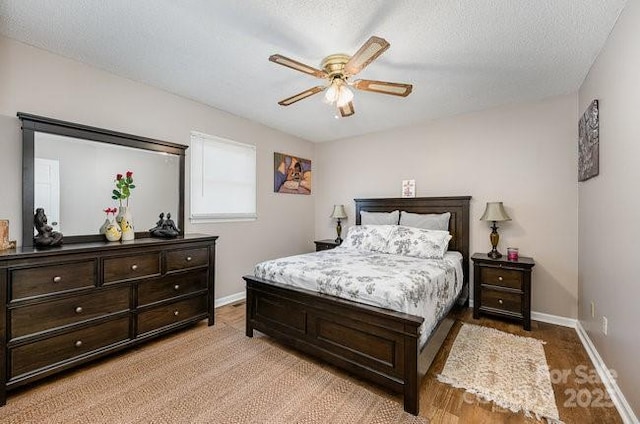 bedroom featuring a textured ceiling and ceiling fan