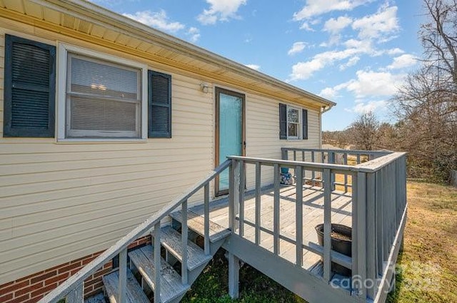 property entrance with a wooden deck