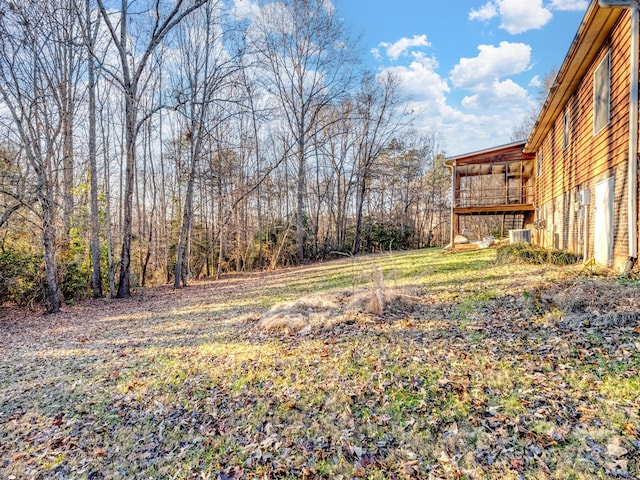 view of yard with a wooden deck