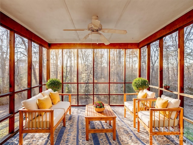 sunroom / solarium featuring an outdoor living space and a ceiling fan