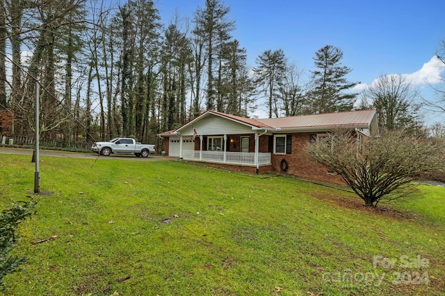 ranch-style home with a porch and a front yard