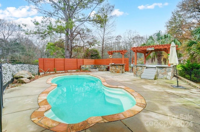 view of swimming pool with a pergola and a patio