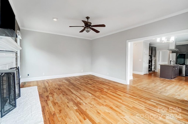 unfurnished living room with ceiling fan, light hardwood / wood-style floors, and crown molding