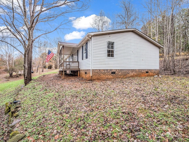 view of property exterior featuring a porch