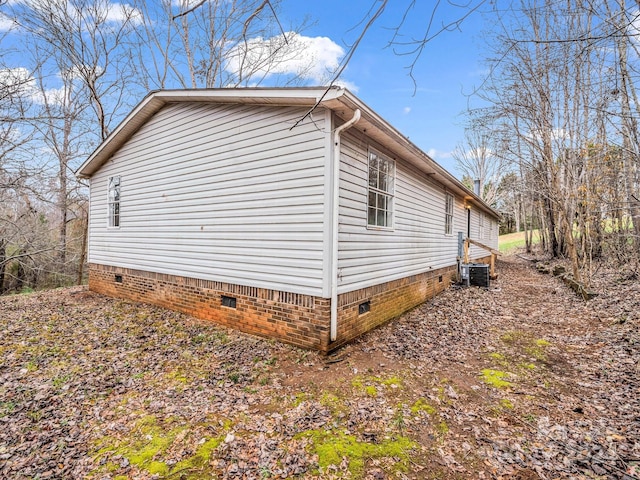 view of side of property featuring central AC unit