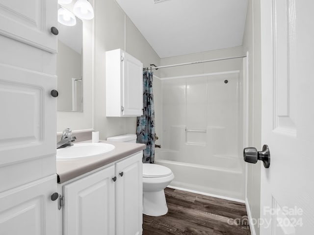 full bathroom with shower / bathtub combination with curtain, vanity, toilet, and wood-type flooring