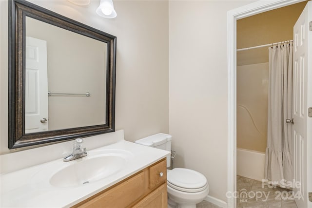 full bathroom featuring shower / tub combo, vanity, and toilet