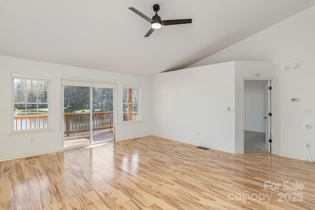 empty room featuring light wood-type flooring, vaulted ceiling, and ceiling fan