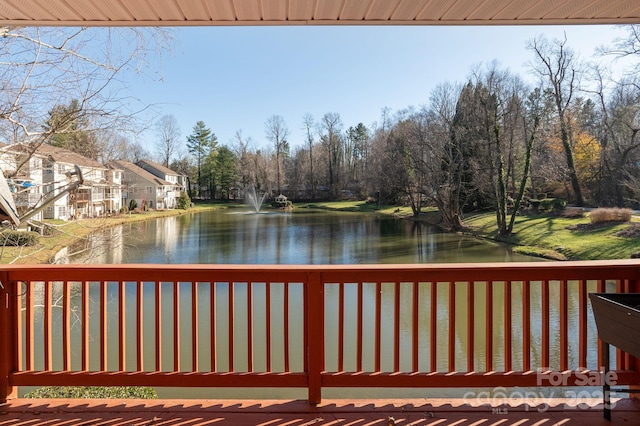 wooden terrace with a water view