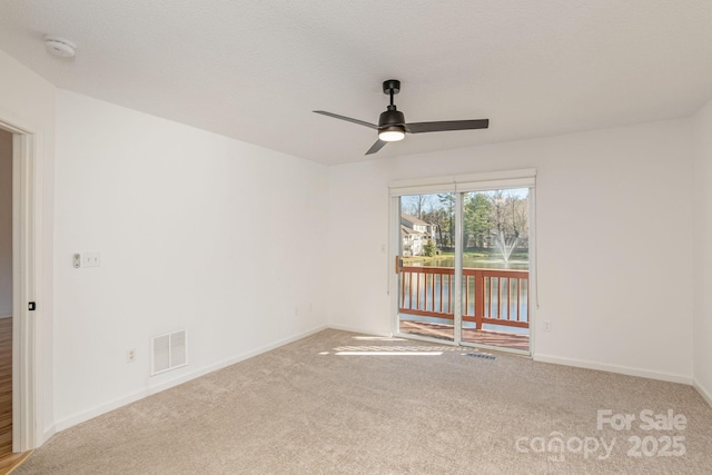 unfurnished room featuring ceiling fan and light colored carpet