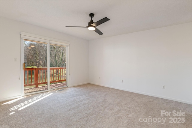 carpeted empty room with ceiling fan