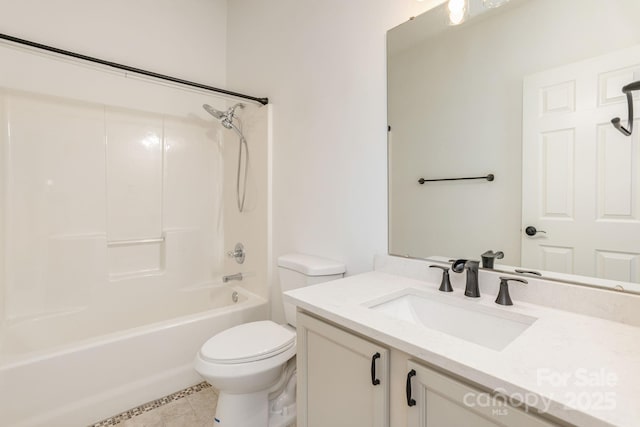 full bathroom with tile patterned floors, vanity, toilet, and shower / tub combination